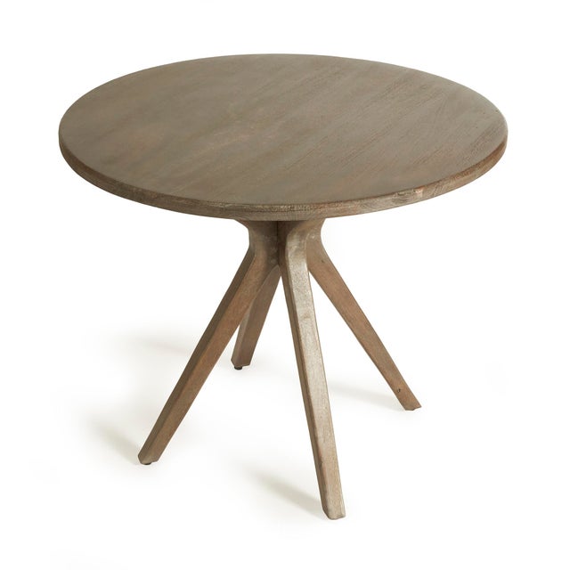 Made of a solid mango wood in a streamlined, midcentury style, the Mercier Café Table is a stylish piece. With a smooth...