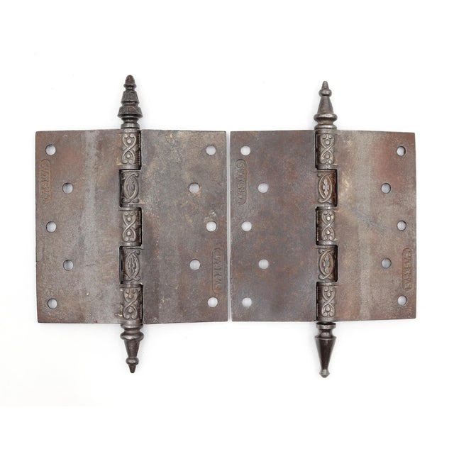 Victorian style door hinges made of cast iron with steeple tips, five knuckles, and a staggered hole pattern. The original...