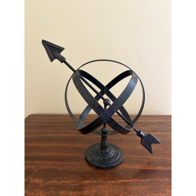 A beautifully crafted iron armillary sphere, evoking the timeless elegance of classical European gardens. Pieces like this...
