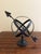 A beautifully crafted iron armillary sphere, evoking the timeless elegance of classical European gardens. Pieces like this...