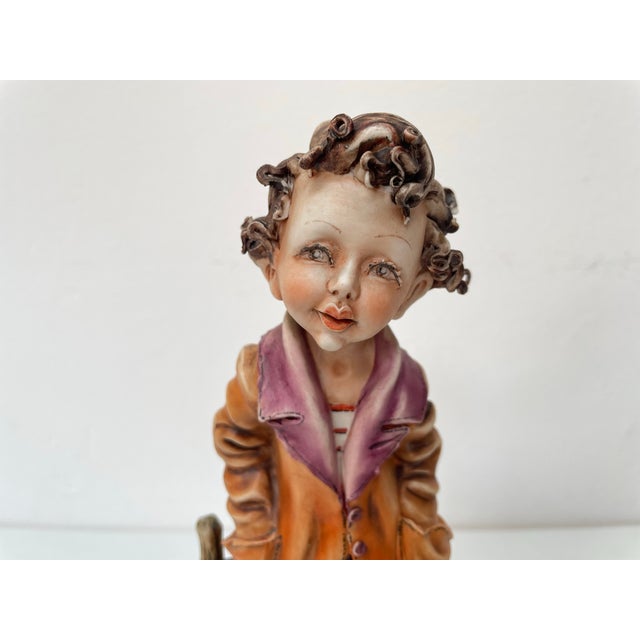 This beautiful Capodimonte sculpture, signed by the artist Milio, depicts a boy with his dog. This artwork was created in...