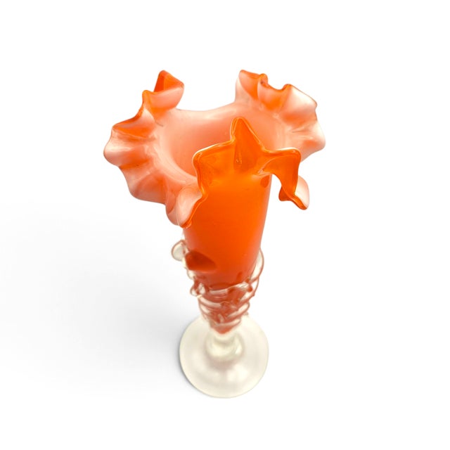 An exquisite vintage mid-century Murano hand-blown art glass trumpet vase crafted in Italy. Featuring a vibrant persimmon-...