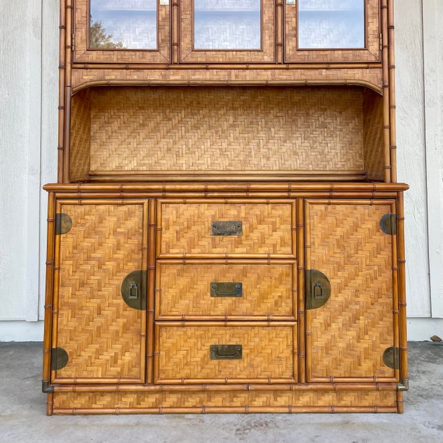 Beautiful boho chic two-piece hutch with basket weave rattan and faux bamboo trim. The piece is in excellent vintage...