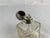 This exquisite British sterling silver and cut glass perfume bottle is a rare and elegant piece, combining intricate...
