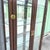 Campaign Vintage Campaign-Style Wood and Brass Lighted Curio Display Cabinet For Sale - Image 3 of 10