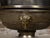 An English Regency style coal burner fireplace urn grate from the 19th century with brass volutes and ram's head. This...