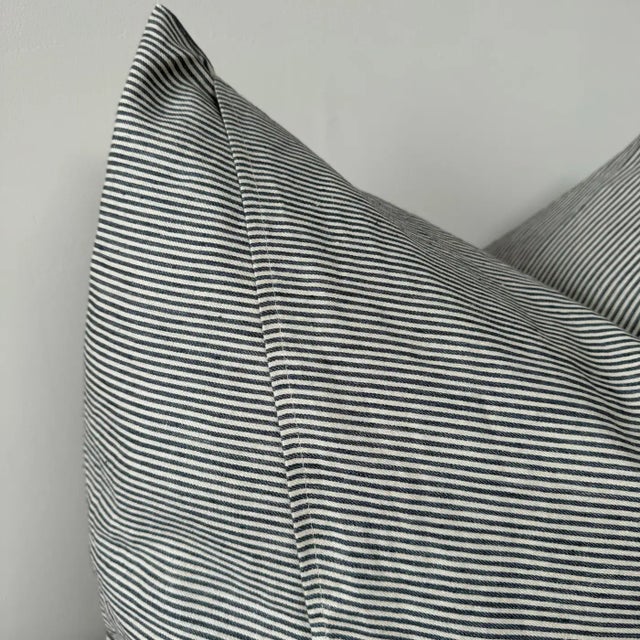 Libeco Home European ticking stripe pillow cover in navy and natural linen. Our pillows are constructed with the finest...