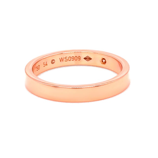 A refined Cartier C de Cartier wedding band crafted in 18ct rose gold, featuring a single brilliant cut diamond set within...