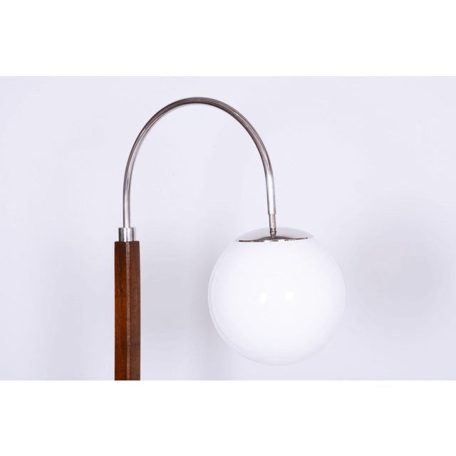 This elegant and characteristically shaped Art Deco floor lamp dates from the 1930s in Czechoslovakia and bears the...
