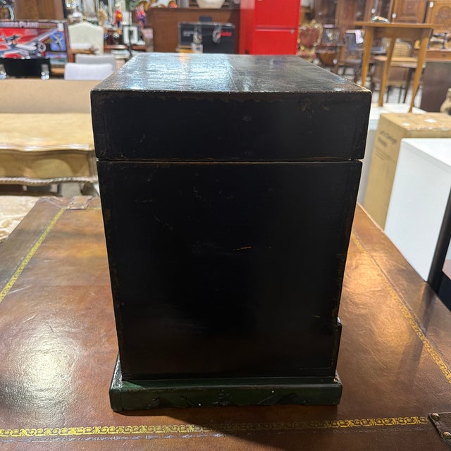 A striking example of mid-19th century Chinese provincial craftsmanship, this antique Gansu tabletop chest—affectionately...