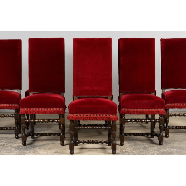 A grand set of ten early 20th century French Louis XIII style dining chairs, sourced in Provence. Each chair features a...