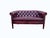 A striking vintage English Chesterfield lounge group in rich oxblood red leather, comprising two two-seater sofas and one...