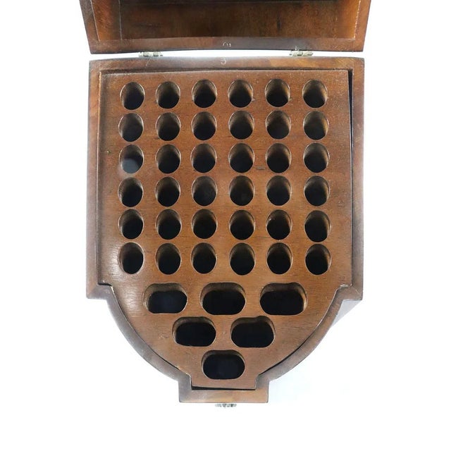 A finely crafted pair of mahogany knife boxes, each of serpentine fronted form with hinged domed lids, the tops inset with...