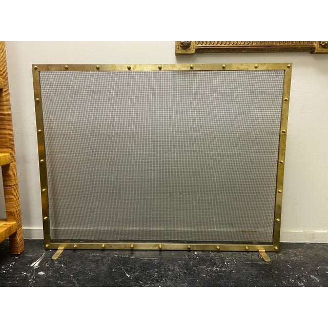 Handcrafted custom modern metal and brass wire mesh fireplace screen.