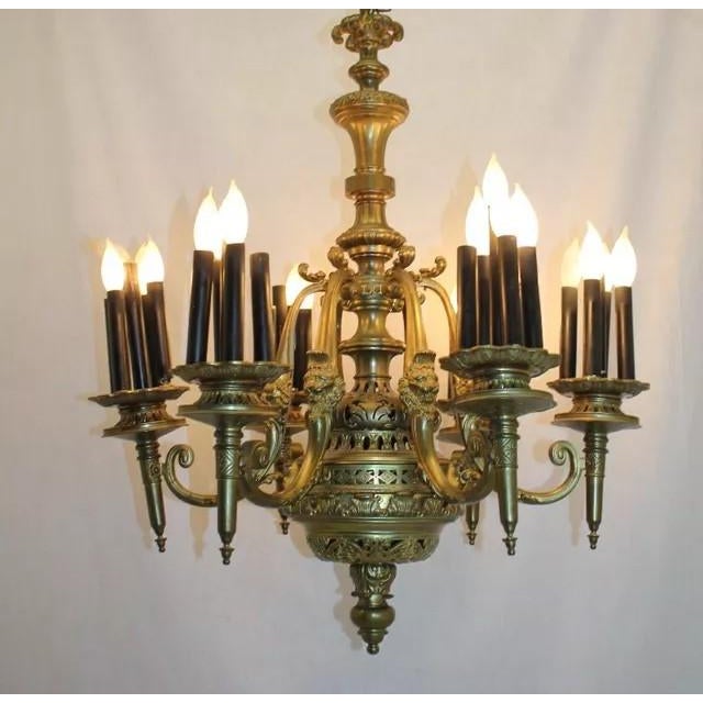 Outstanding authentic antique Bronze chandelier with 6 Torchiere arms, circa 19th. Each torchiere arm consists of 6...