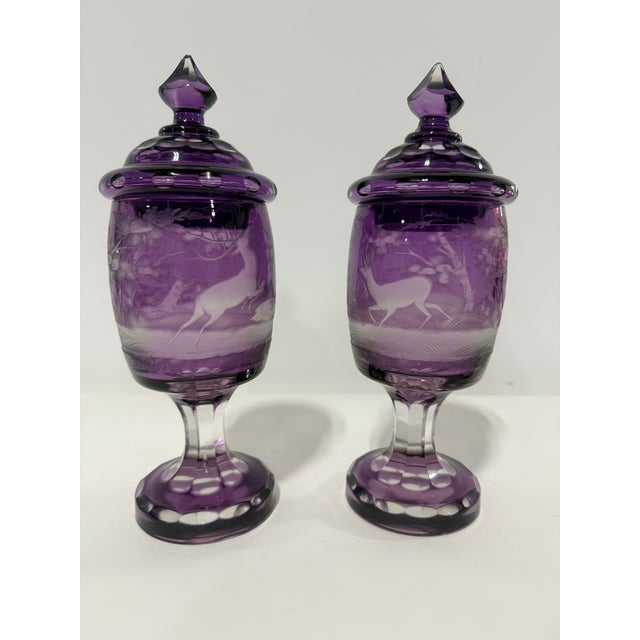 Pair Of Bohemian Amethyst Engraved Covered Beakers, Late 19th Century This refined pair of covered beakers is executed in...