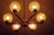 Dazzling gold-plated brass Italian chandelier with 6 crackle-glass globes on intricately designed arms, by Angelo Brotto...