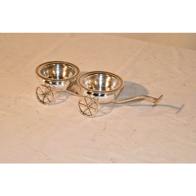 Circa 1960-1969 double wine coaster trolley from F.B.Rogers Silver Company. This is a darling wine trolley for serving two...