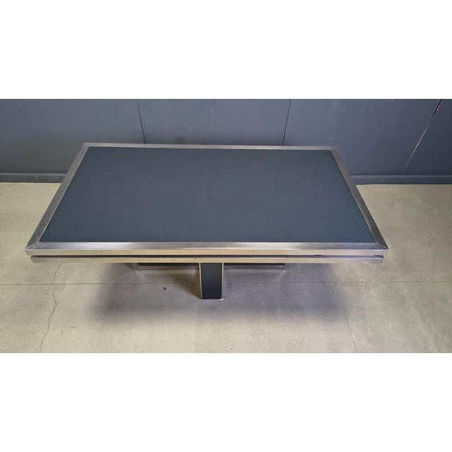 Italian chrome dining table with a black glass top. Good condition. 1970s - Italy Dimensions: Height: 74cm Width 180cm...