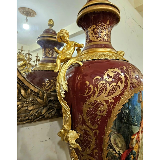Make a bold statement with this elegant burgundy porcelain vase, designed in a refined French style. The rich guinda...