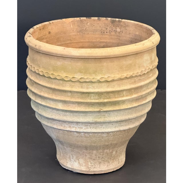 A fine large round Greek garden planter or pot of terracotta from Crete, 15 1/8 inches in diameter, featuring a stylized...