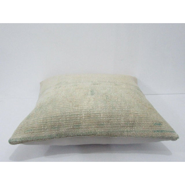 Decorative pillow cover made from a vintage Turkish handknotted rug. Backed with good quality cotton fabric. Pillow...