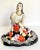 Here is a beautiful hand-painted figurine of a woman in a full floral skirt made in USSR in the 1960's. The woman features...