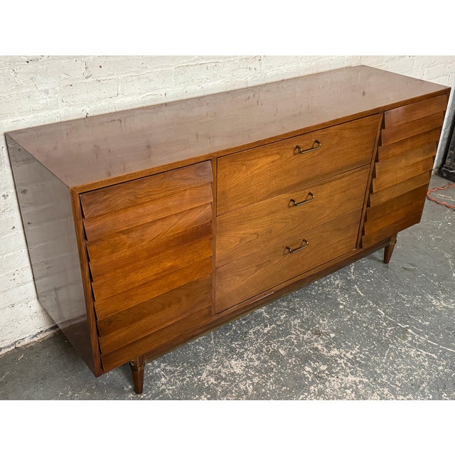 This lowboy dresser from Carlton House is similar in design and construction to Merton Gershun's "Dania" collection for...