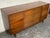 This lowboy dresser from Carlton House is similar in design and construction to Merton Gershun's "Dania" collection for...