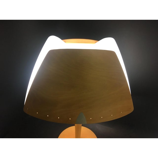 Fantastic lamp by Lucid company, has the stamp inside, the outside of the lamp is made of wood, as well as the handle;...