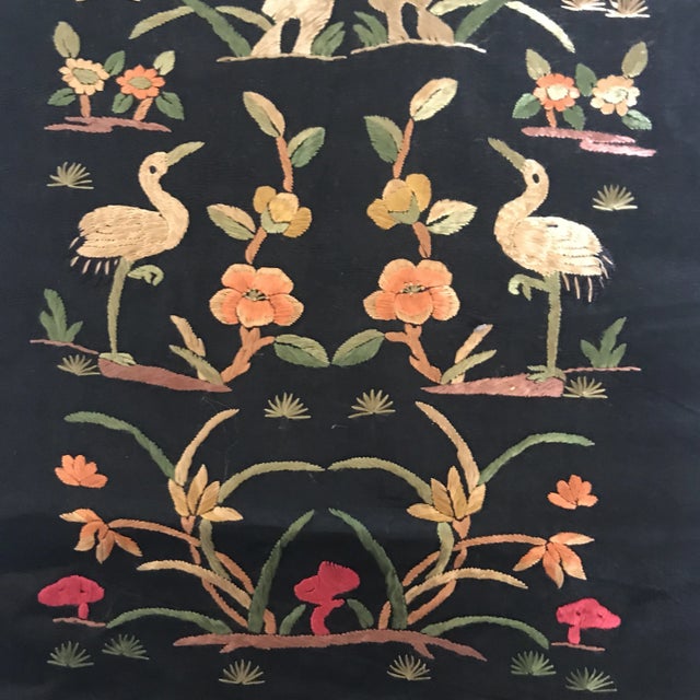 Vintage embroidered Asian textile fragment from a Chinese Opera Robe with Chinese Cranes in nature.