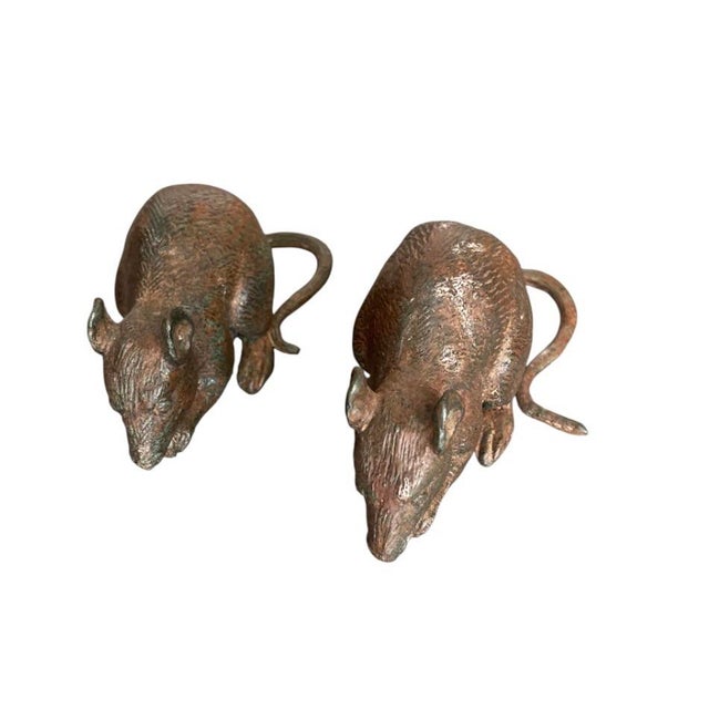 This charming duo features two meticulously crafted miniature mice, cast in solid bronze with a rich, aged patina. Each...