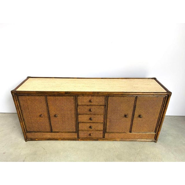 Gorgeous sideboard with 4 doors and 5 central drawers Made from bamboo, wood and rattan panels and a beautiful travertine...