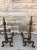Pair of antique brass andirons with turned columns, spire top and claw feet. Brass has a wonderful patina.