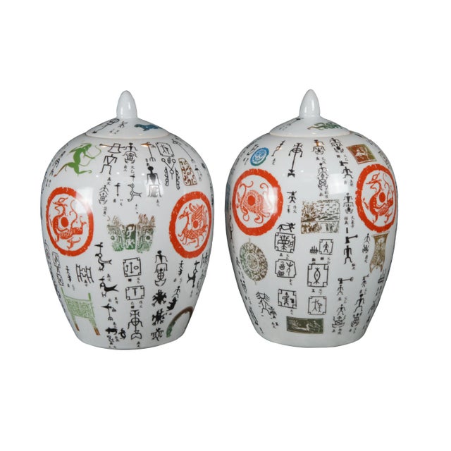 Pair of Chinese Famille Rose ginger jars. Made from porcelain with a uniquely finished exterior featuring animals and...