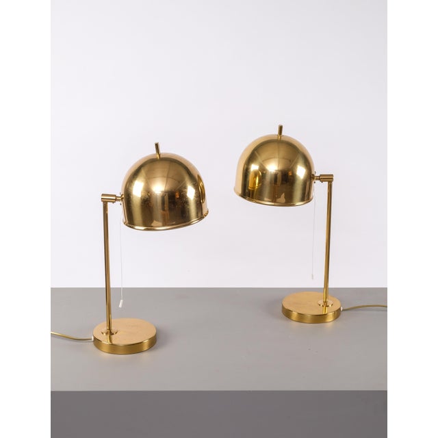 Set of two table lamps in brass, model B-075 manufactured by Bergboms, Sweden, 1960s. New wiring. Adjustable lampshades....