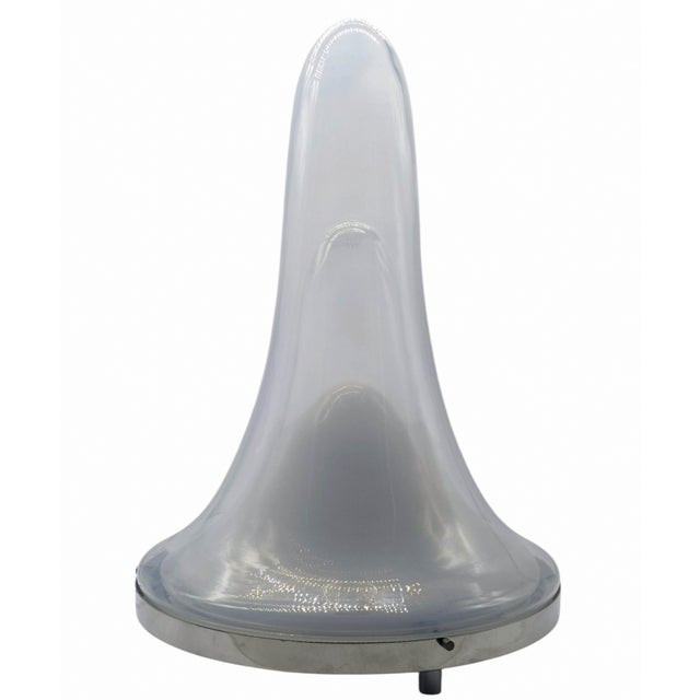 A beautiful and iconic Italian Space Age-style table lamp, model LS144, from AV Mazzega. The lamp stands out for its...