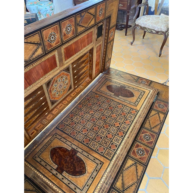 A marquetry, micro mosaic inlayed games table made in Syria around the turn of the 19th and early 20th Century. Complete...