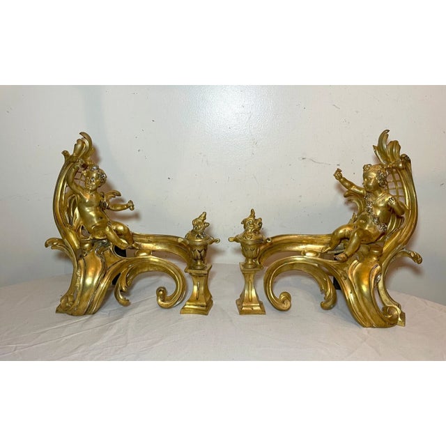 Up for sale is a high quality pair of antique 19th century ornate dore bronze figural fireplace chenets. The pair is cast...