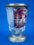 A delightful cup-shaped vase, made of very thick, entirely hand-cut crystal, clear in some areas and red in others,...