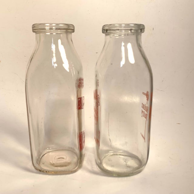 Circa 1940s pair of one-pint glass milk bottles, including PET Dairy Products Co. and Kainz Dairy of Chicago, both with...