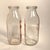 Circa 1940s pair of one-pint glass milk bottles, including PET Dairy Products Co. and Kainz Dairy of Chicago, both with...