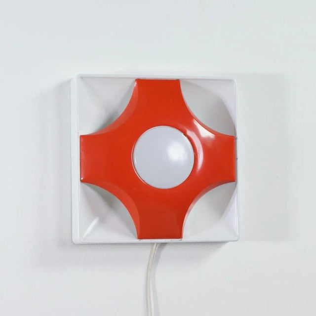 Space age wall lamp designed and made by Sölken-Leuchten, Germany in the 1970s. This minimalist pop art wall lamp is made...
