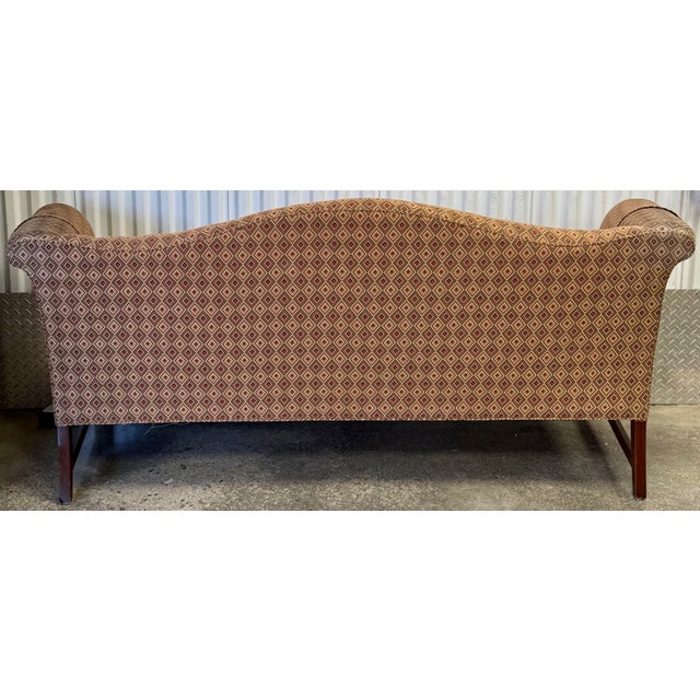 Classic camelback sofa by Southwood furniture. Sofa features a tight back and seat , Chinese chippendale block feet with...