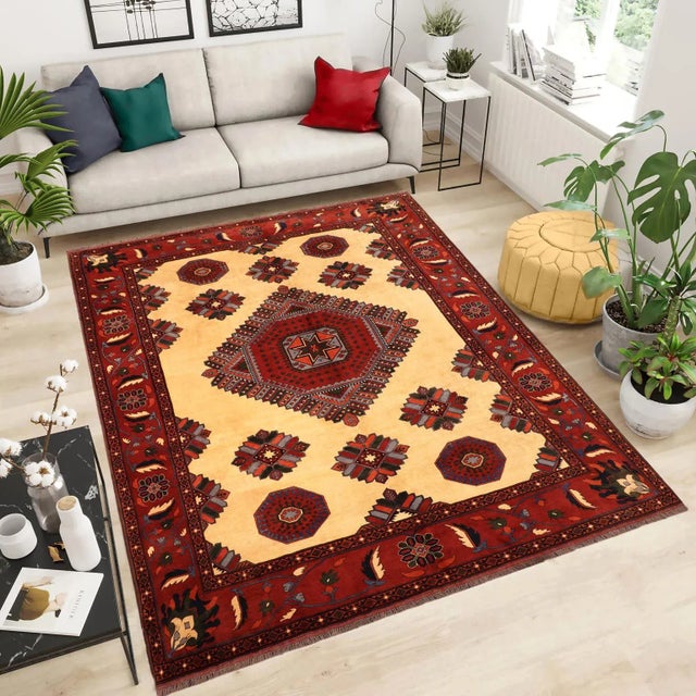 Create a new dimension of style in your home with this breathtaking semi-Vintage hand-knotted kargahi rug featuring...