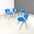 Set of four stackable chairs, model DSC, with seat and back in solid beech wood painted blue with round aluminium legs....