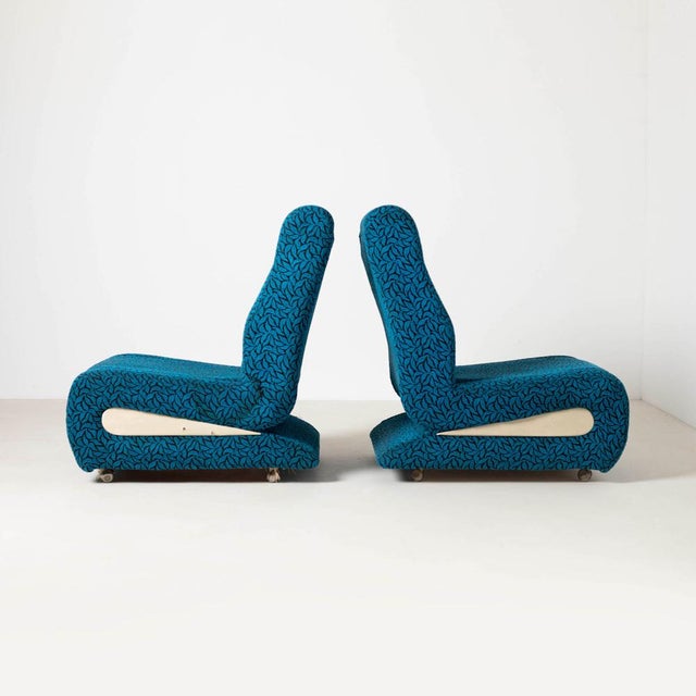 Set of 2 space age style lounge chairs in blue patterned upholstery. Produced in former Czechosloakia, 1970s. Whells on...
