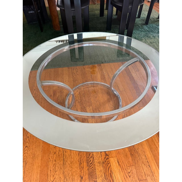 Vintage Bernhardt Furniture Company Coffee Table circa 1970 with metal base and circular glass top ringed in mirror....