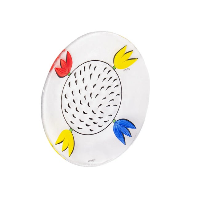A "Tulipa" glass plate designed by Swedish artist Ulrica Hydman (1938-2018) for Swedish glass company Kosta Boda. Made in...