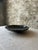 Add a dramatic, natural touch to your decor with this striking polished black fossil marble bowl. Crafted from solid...